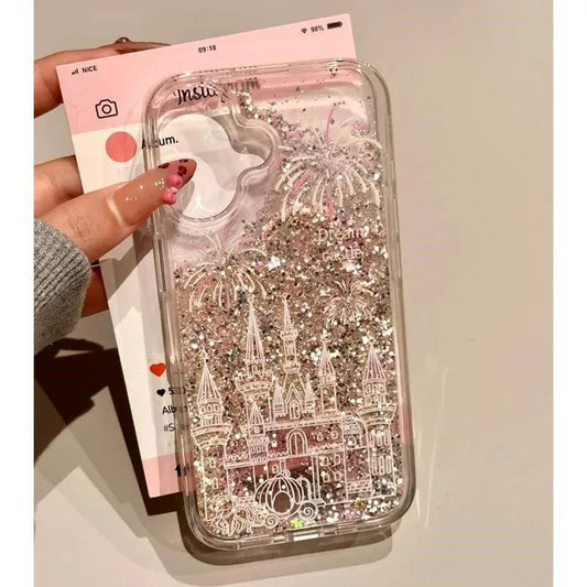 Phone case with castle design and glittery effect held by a hand.