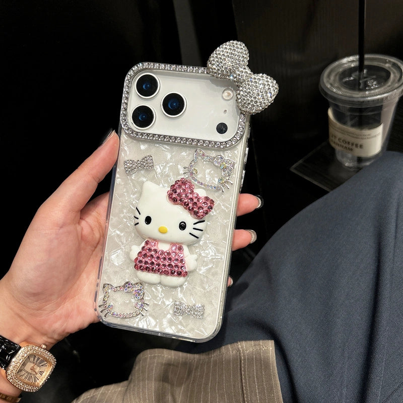 Phone case with Kitty design held by a person, with a blurred background