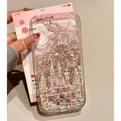 Phone case with castle design and glittery effect held by a hand.