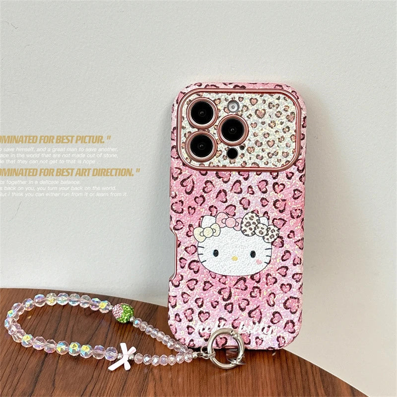 Pink leopard print phone case with a character design on a wooden surface