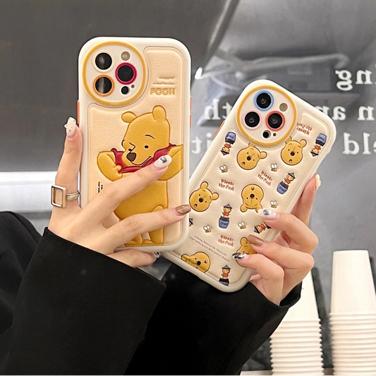 Two phone cases with cartoon bear design