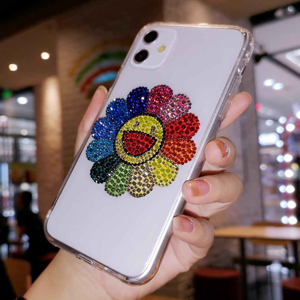 Coque iPhone faite à la main, luxueuse et scintillante, ornée de diamants et de tournesols colorés.