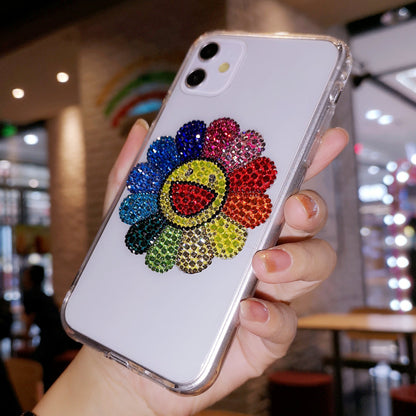 Coque iPhone faite à la main, luxueuse et scintillante, ornée de diamants et de tournesols colorés.