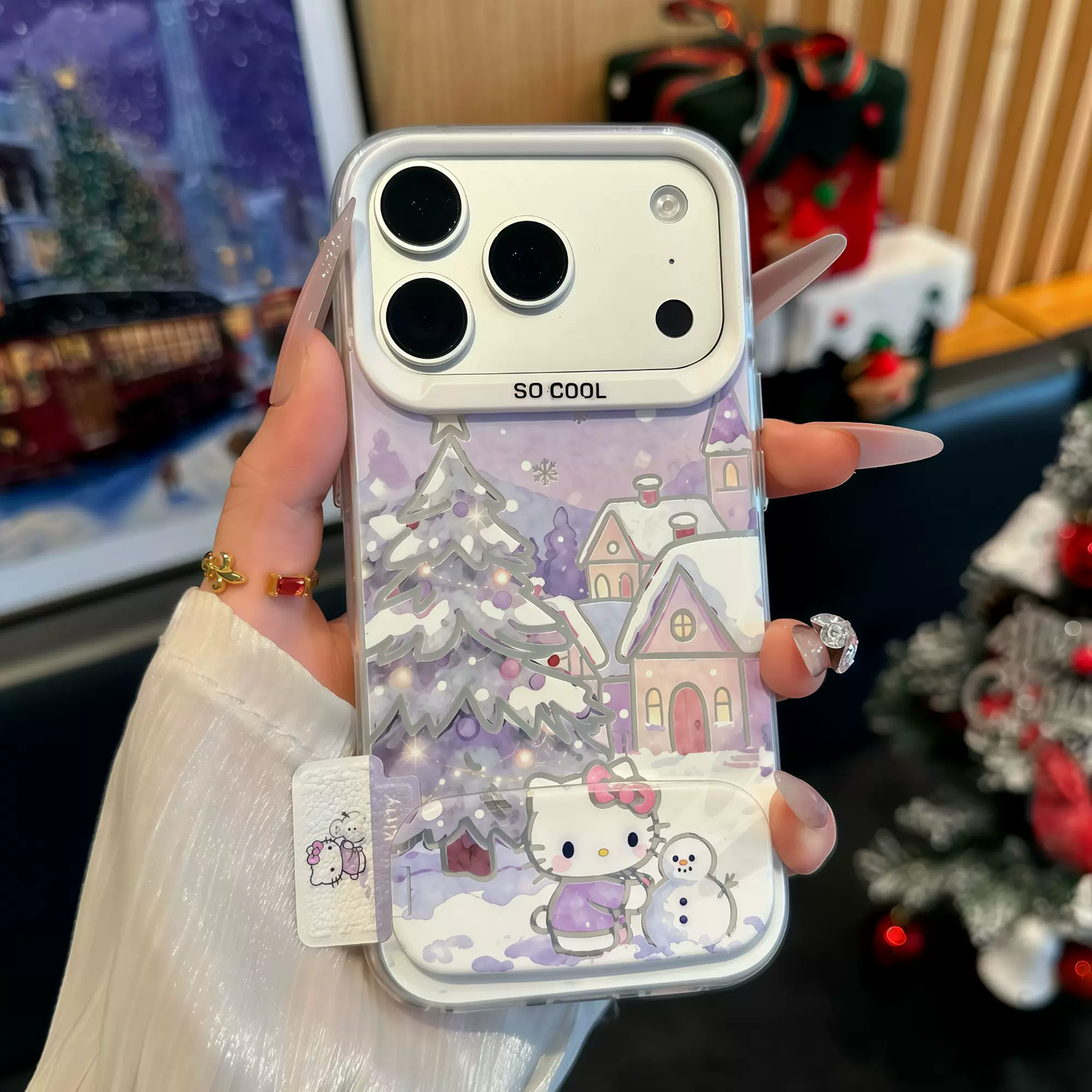 Light purple Christmas tree, snowman, and Hello Kitty phone case