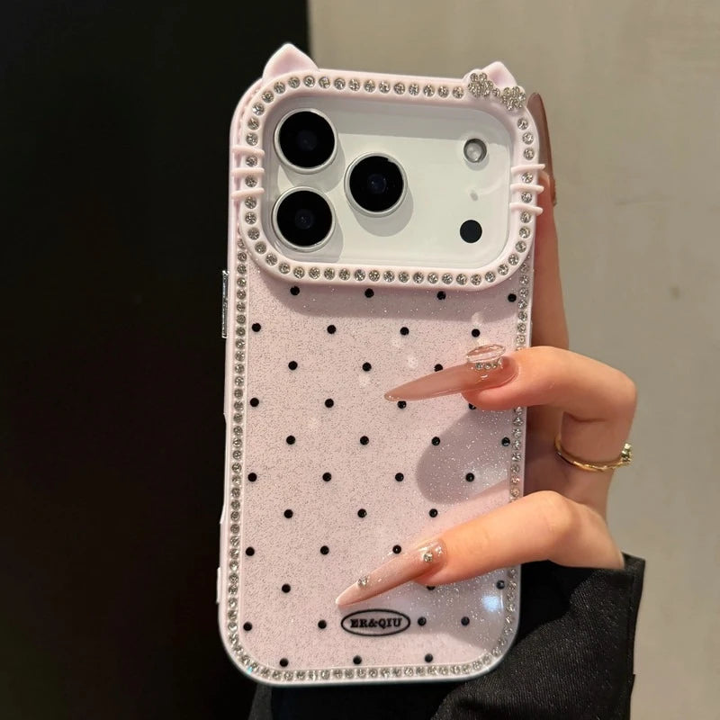 Phone case with polka dots and cat ears held by a hand