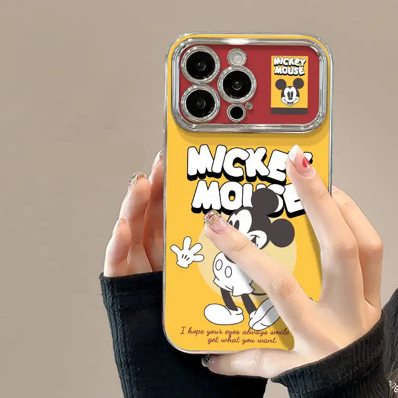 Phone case with Mick Mouse design held by a hand, brand visible
