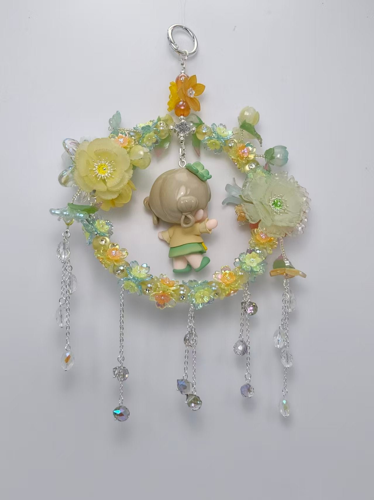 6e9c1a0c7070988fe64720e12e7129bc_7ca1b061-9510-4e2f-8792-5a1500f620e4.jpg Handmade Yellow Floral Wreath Charm with Cute Girl Figurine