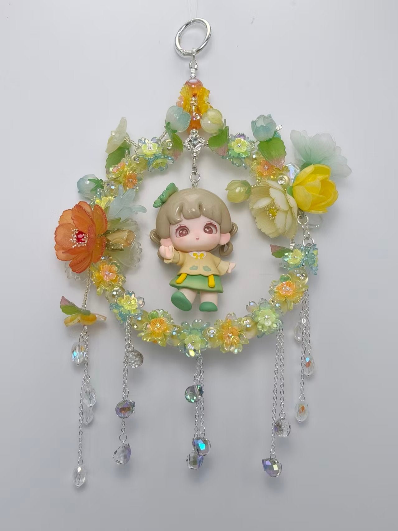 7ce3ced83ed4e60b582356697f5f05b8_2e4b513f-1972-4e09-8b1c-4d1123c71503.jpg Handmade Yellow Floral Wreath Charm with Cute Girl Figurine